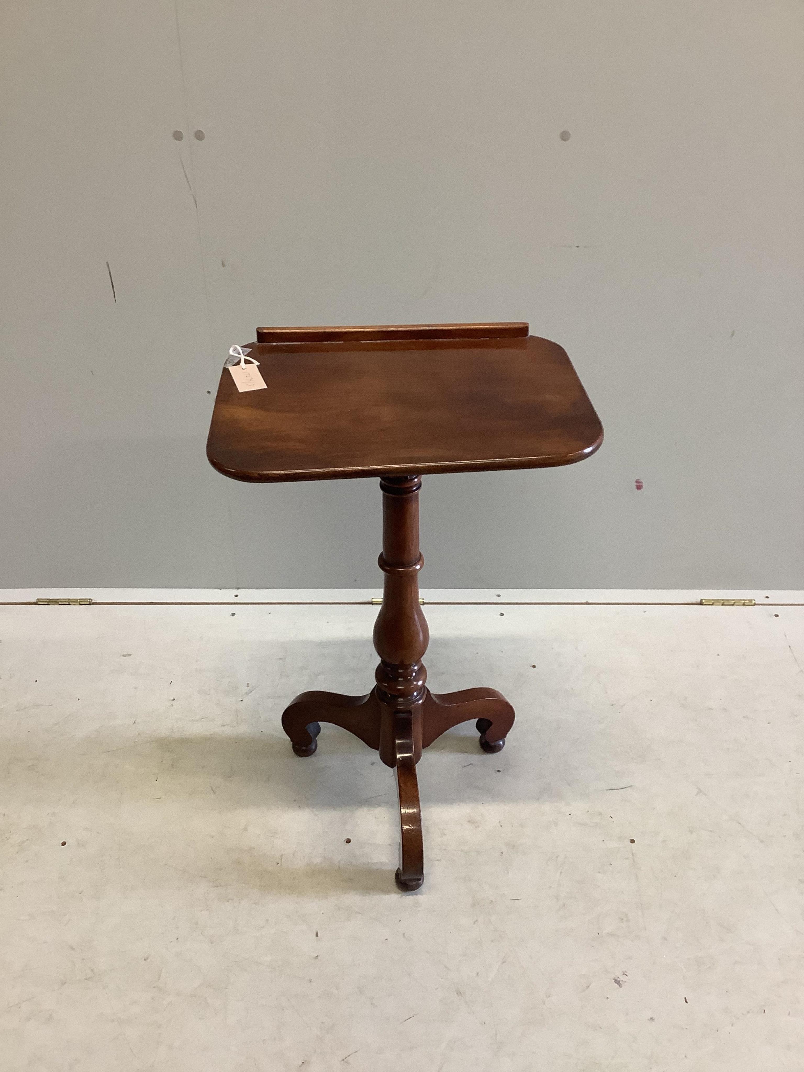 A Victorian mahogany reading table with tilt top, on tripod base, width 45cm, depth 35cm, height 90cm. Condition - fair